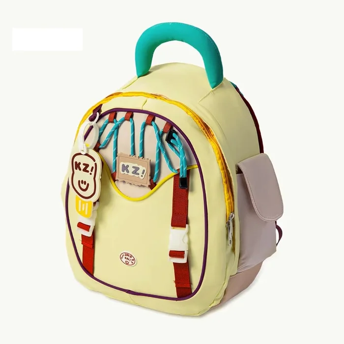 New College Style Backpack In Yellow With Hanging Rubber Tag F